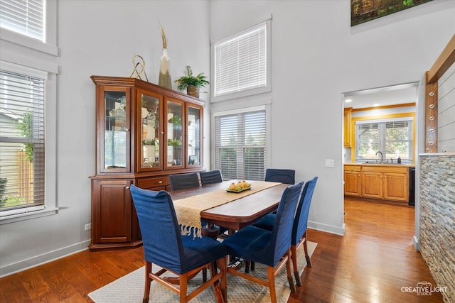 189 Cross St, Sugar Grove, IL 60554 - dining space featuring a towering ceiling, healthy amount of natural light, and wood finished floors