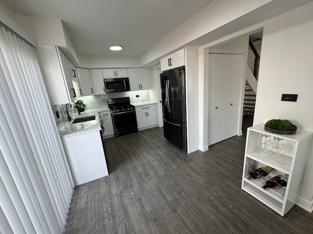 1805 Marquette Ln, Hoffman Estates, IL 60169 - kitchen featuring black appliances, light countertops, dark wood-type flooring, white cabinets, and recessed lighting