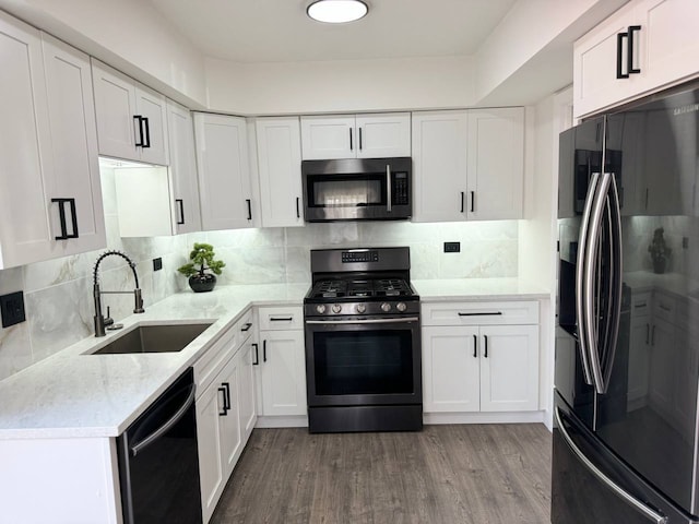1805 Marquette Ln, Hoffman Estates, IL 60169 - kitchen featuring stainless steel microwave, black refrigerator with ice dispenser, range with gas cooktop, dishwashing machine, and wood finished floors