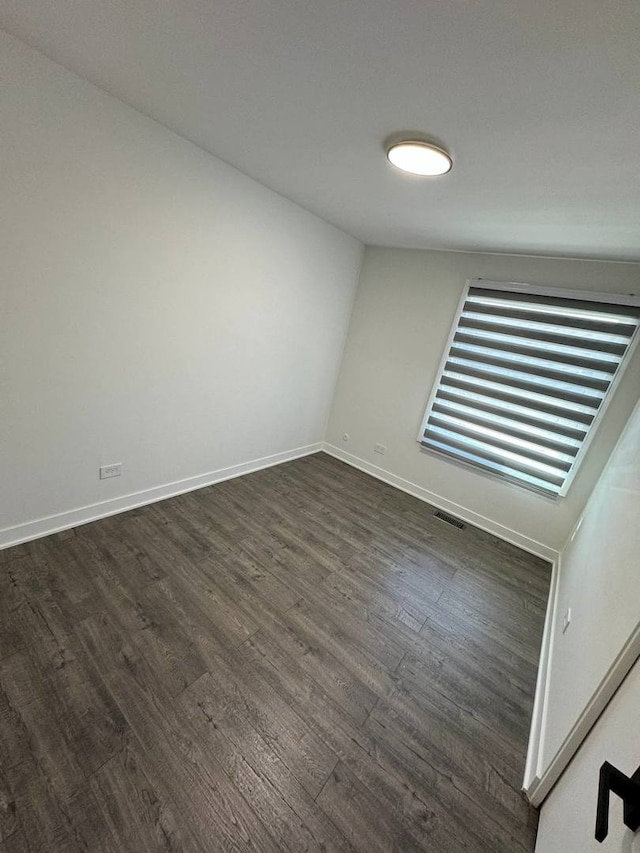 1805 Marquette Ln, Hoffman Estates, IL 60169 - empty room featuring dark wood-style floors and baseboards