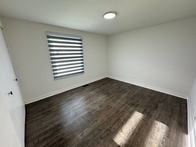 1805 Marquette Ln, Hoffman Estates, IL 60169 - empty room featuring dark wood finished floors and baseboards