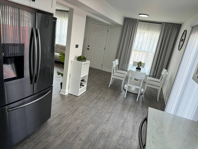 1805 Marquette Ln, Hoffman Estates, IL 60169 - kitchen with stainless steel refrigerator with ice dispenser, dark wood-style floors, and white cabinetry