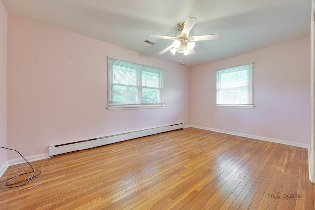 38W333 Oakwood Dr, Saint Charles, IL 60175 - empty room featuring a baseboard radiator, light wood-style floors, and ceiling fan
