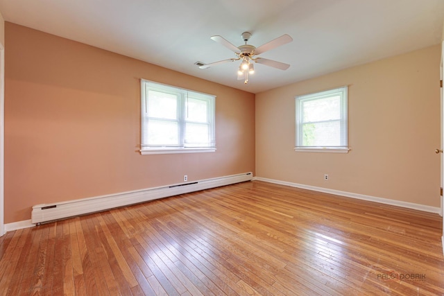 38W333 Oakwood Dr, Saint Charles, IL 60175 - spare room featuring baseboard heating, healthy amount of natural light, and light wood-style floors