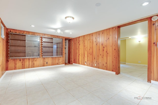 38W333 Oakwood Dr, Saint Charles, IL 60175 - unfurnished room featuring wooden walls, built in features, and recessed lighting