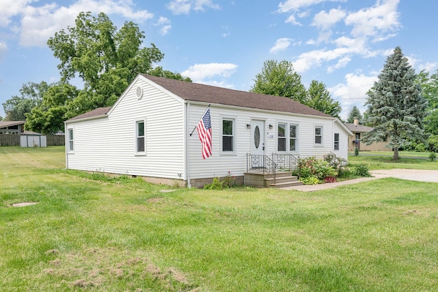 148 E Francis Rd, New Lenox, IL 60451 - view of front of property with a front yard, a storage unit, a shingled roof, and crawl space