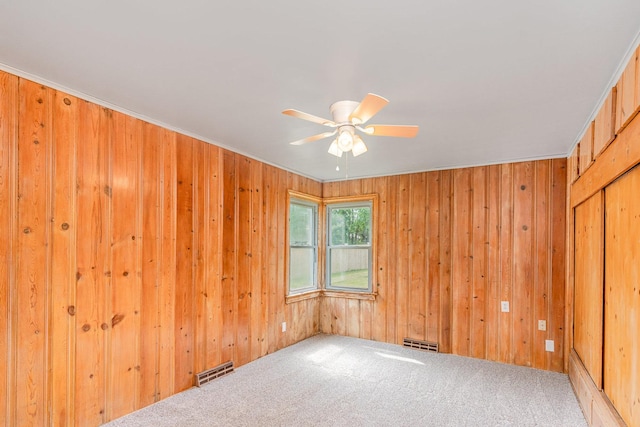 148 E Francis Rd, New Lenox, IL 60451 - carpeted spare room featuring a ceiling fan and wooden walls