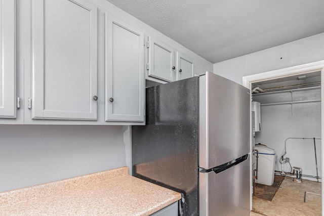 148 E Francis Rd, New Lenox, IL 60451 - kitchen featuring freestanding refrigerator, light countertops, and washer / dryer