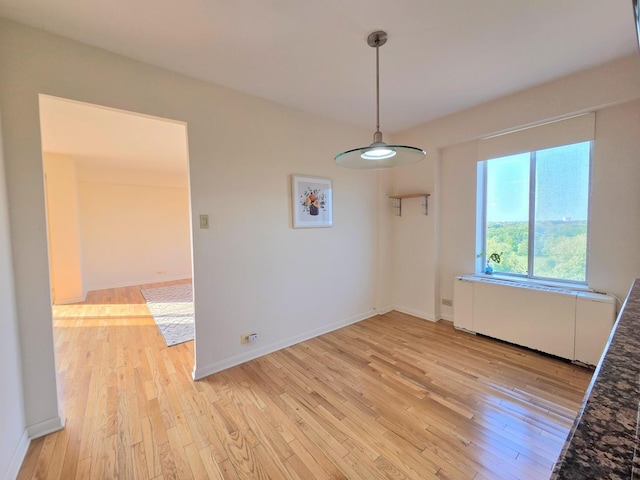 6833 N Kedzie Ave Unit 816, Chicago, IL 60645 - unfurnished dining area featuring light wood finished floors and baseboards