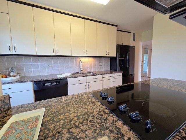 6833 N Kedzie Ave Unit 816, Chicago, IL 60645 - kitchen with black appliances, decorative backsplash, dark stone countertops, and white cabinets