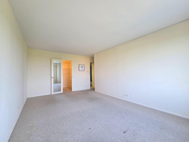 6833 N Kedzie Ave Unit 816, Chicago, IL 60645 - empty room with carpet flooring and baseboards