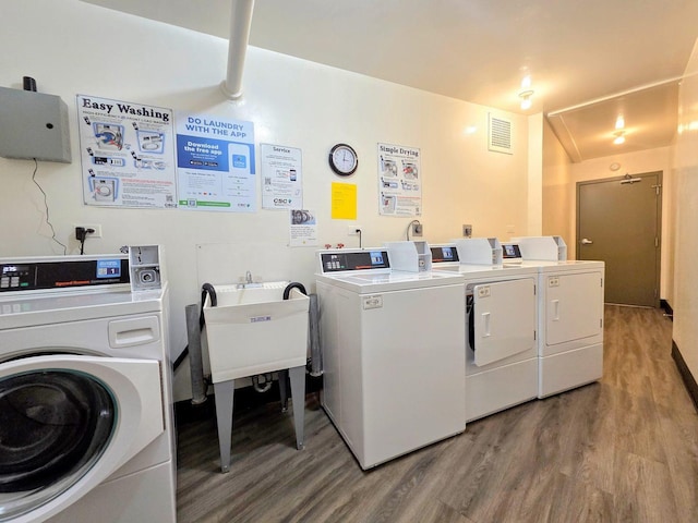 6833 N Kedzie Ave Unit 816, Chicago, IL 60645 - community laundry featuring washing machine and clothes dryer and light wood-style flooring