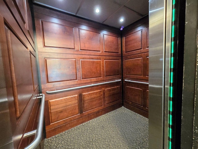 6833 N Kedzie Ave Unit 816, Chicago, IL 60645 - elevator featuring a decorative wall, freestanding refrigerator, fridge, and recessed lighting