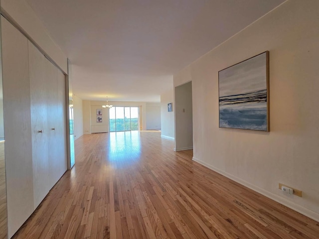 6833 N Kedzie Ave Unit 816, Chicago, IL 60645 - hall with a chandelier and wood finished floors