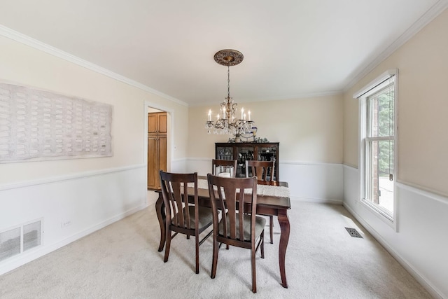 4116 N Terramere Ave, Arlington Heights, IL 60004 - dining space featuring a chandelier, light colored carpet, and ornamental molding