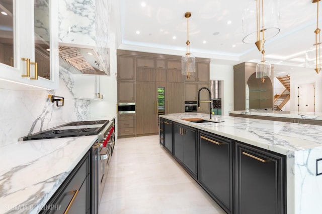219 Lincoln Dr, Glencoe, IL 60022 - kitchen with high end stainless steel range, decorative backsplash, hanging light fixtures, glass insert cabinets, and recessed lighting
