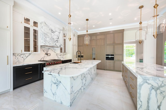 219 Lincoln Dr, Glencoe, IL 60022 - kitchen with a large island, backsplash, crown molding, glass insert cabinets, and light stone countertops