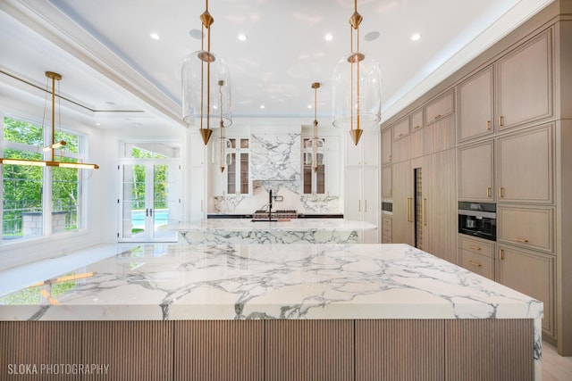 219 Lincoln Dr, Glencoe, IL 60022 - kitchen with a spacious island, light stone counters, french doors, glass insert cabinets, and recessed lighting