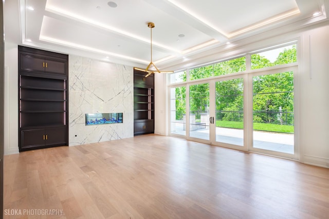 219 Lincoln Dr, Glencoe, IL 60022 - unfurnished living room with wood finished floors, a premium fireplace, and built in features
