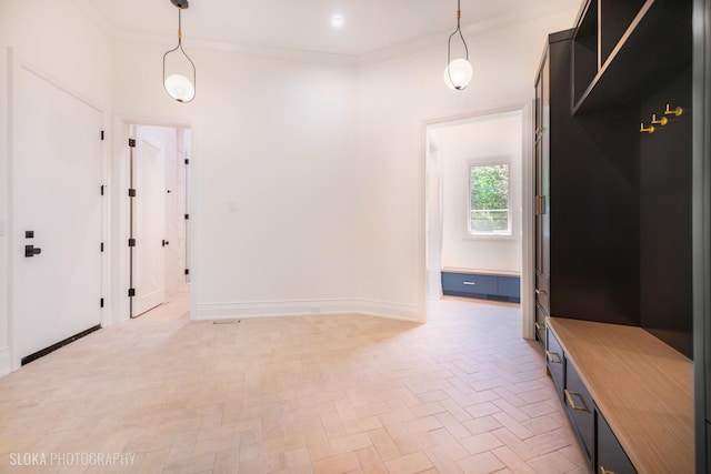 219 Lincoln Dr, Glencoe, IL 60022 - mudroom featuring ornamental molding and brick patterned flooring