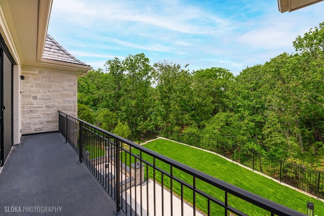 219 Lincoln Dr, Glencoe, IL 60022 - balcony featuring a wooded view