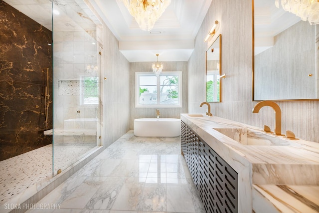 219 Lincoln Dr, Glencoe, IL 60022 - bathroom featuring a chandelier, a freestanding tub, marble tiled flooring, a walk in shower, and double vanity