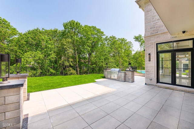219 Lincoln Dr, Glencoe, IL 60022 - view of patio featuring an outdoor kitchen and french doors