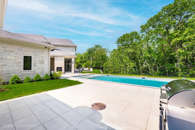 219 Lincoln Dr, Glencoe, IL 60022 - swimming pool with a patio, a yard, and area for grilling