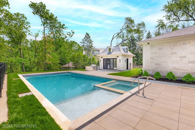 219 Lincoln Dr, Glencoe, IL 60022 - view of swimming pool with a storage structure, an outdoor structure, a patio area, a fenced backyard, and a pool with connected hot tub