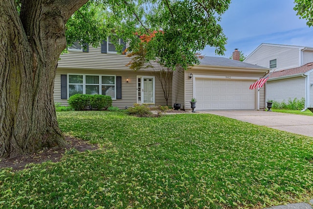 962 Thompson Blvd, Buffalo Grove, IL 60089 - colonial house featuring an attached garage, driveway, and a front yard