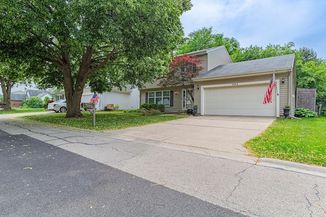 962 Thompson Blvd, Buffalo Grove, IL 60089 - view of front facade with an attached garage, a front yard, and driveway