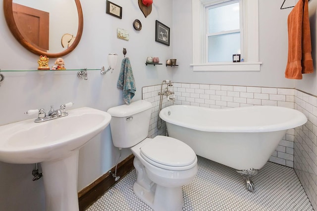 2340 W 19th St, Chicago, IL 60608 - full bathroom with tile patterned floors, tile walls, a freestanding tub, and wainscoting