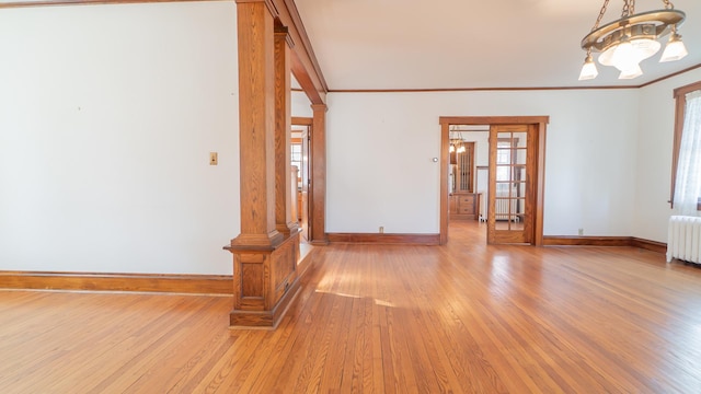 531 E Joliet St, Crown Point, IN 46307 - unfurnished room with a chandelier, light wood-type flooring, radiator, and ornamental molding