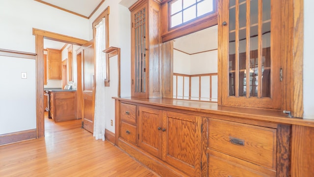 531 E Joliet St, Crown Point, IN 46307 - hallway featuring light wood finished floors and crown molding