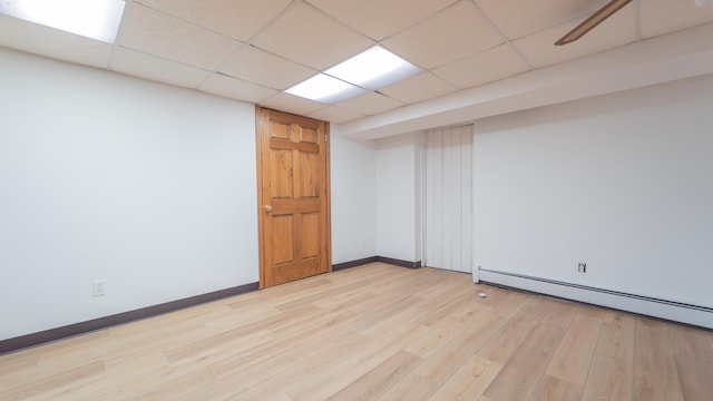 531 E Joliet St, Crown Point, IN 46307 - spare room featuring a baseboard radiator, light wood-type flooring, and a drop ceiling