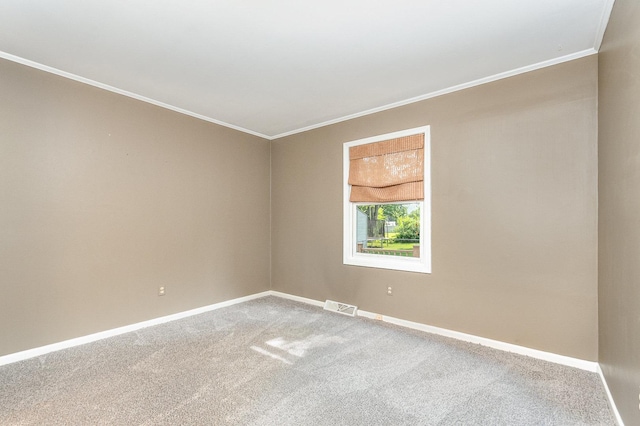 609 Oakwood Dr, Grayslake, IL 60030 - carpeted empty room featuring crown molding and baseboards
