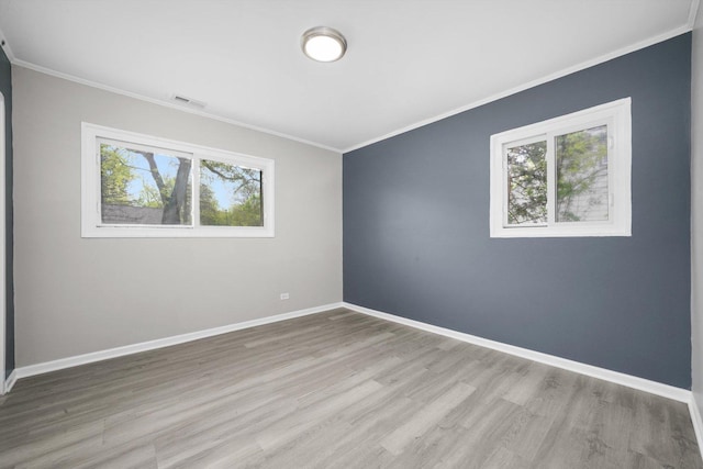 202 Allegheny St, Park Forest, IL 60466 - empty room featuring healthy amount of natural light, crown molding, and wood finished floors