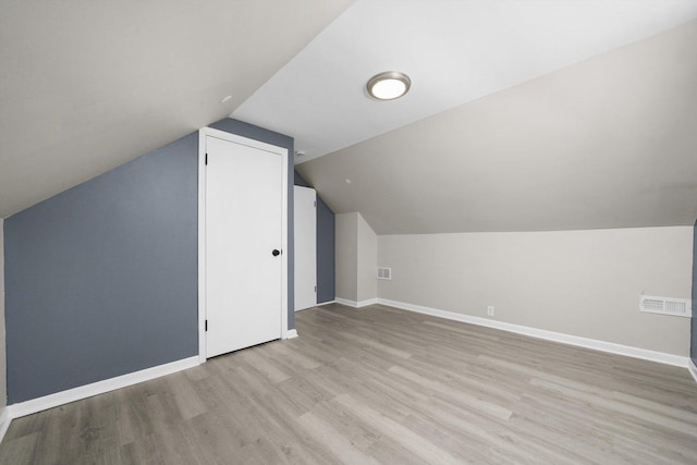 202 Allegheny St, Park Forest, IL 60466 - additional living space with light wood-style floors and vaulted ceiling
