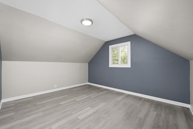 202 Allegheny St, Park Forest, IL 60466 - additional living space featuring wood finished floors and vaulted ceiling