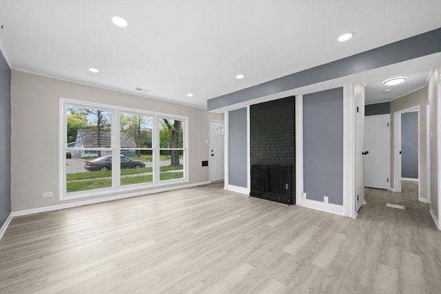 202 Allegheny St, Park Forest, IL 60466 - unfurnished living room featuring light wood finished floors, ornamental molding, a fireplace, and recessed lighting