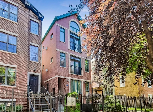 1031 N Mozart St Unit 2, Chicago, IL 60622 - view of building exterior with a fenced front yard