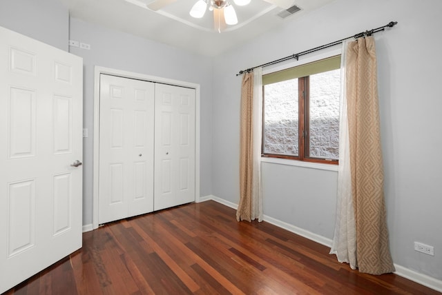 1031 N Mozart St Unit 2, Chicago, IL 60622 - unfurnished bedroom with dark wood-style floors, a closet, and a ceiling fan