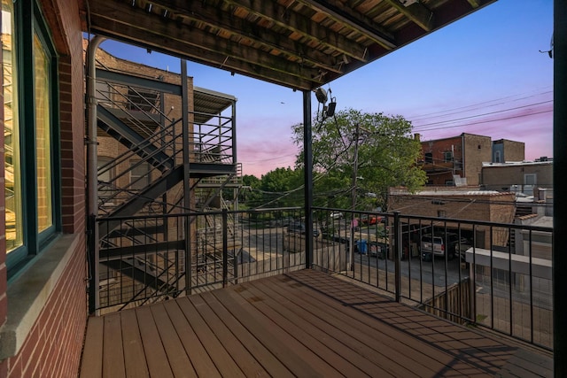 1031 N Mozart St Unit 2, Chicago, IL 60622 - deck at dusk featuring stairs