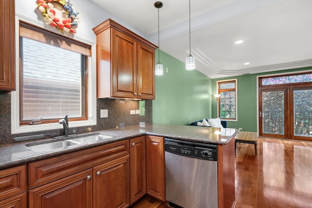 1031 N Mozart St Unit 2, Chicago, IL 60622 - kitchen with dishwasher, wood finished floors, backsplash, brown cabinetry, and pendant lighting