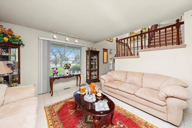 3 Lorraine Ave, Woodridge, IL 60517 - living area featuring light tile patterned flooring, stairs, and rail lighting