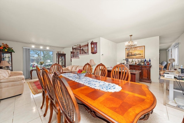 3 Lorraine Ave, Woodridge, IL 60517 - dining space featuring light tile patterned floors, a chandelier, and stairway