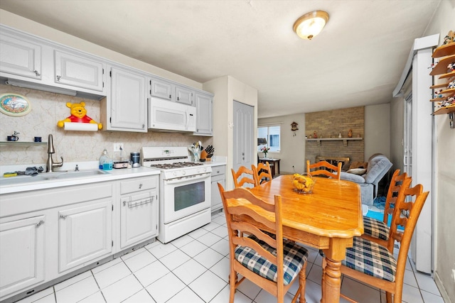 3 Lorraine Ave, Woodridge, IL 60517 - kitchen featuring white appliances, light tile patterned flooring, light countertops, and backsplash