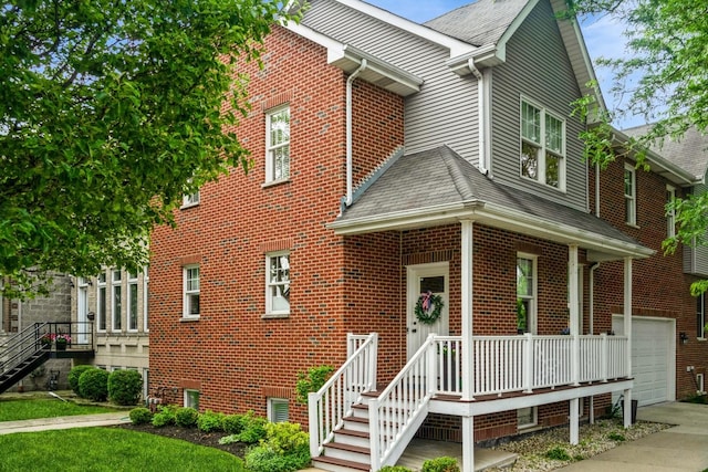 835 W 37th St Unit A, Chicago, IL 60609 - view of front of home featuring brick siding, an attached garage, a shingled roof, and concrete driveway