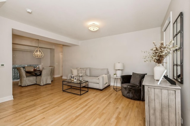835 W 37th St Unit A, Chicago, IL 60609 - living area with light wood-type flooring and a chandelier