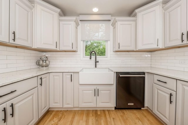 835 W 37th St Unit A, Chicago, IL 60609 - kitchen with stainless steel dishwasher, white cabinetry, light wood-style flooring, backsplash, and recessed lighting